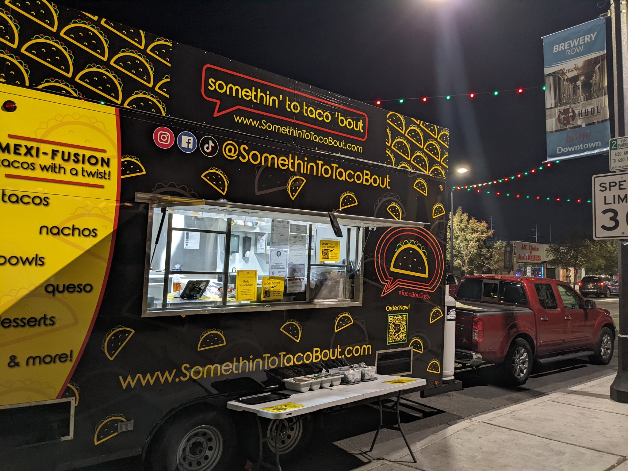 Somethin’ To Taco ’Bout food truck serving guests at an event